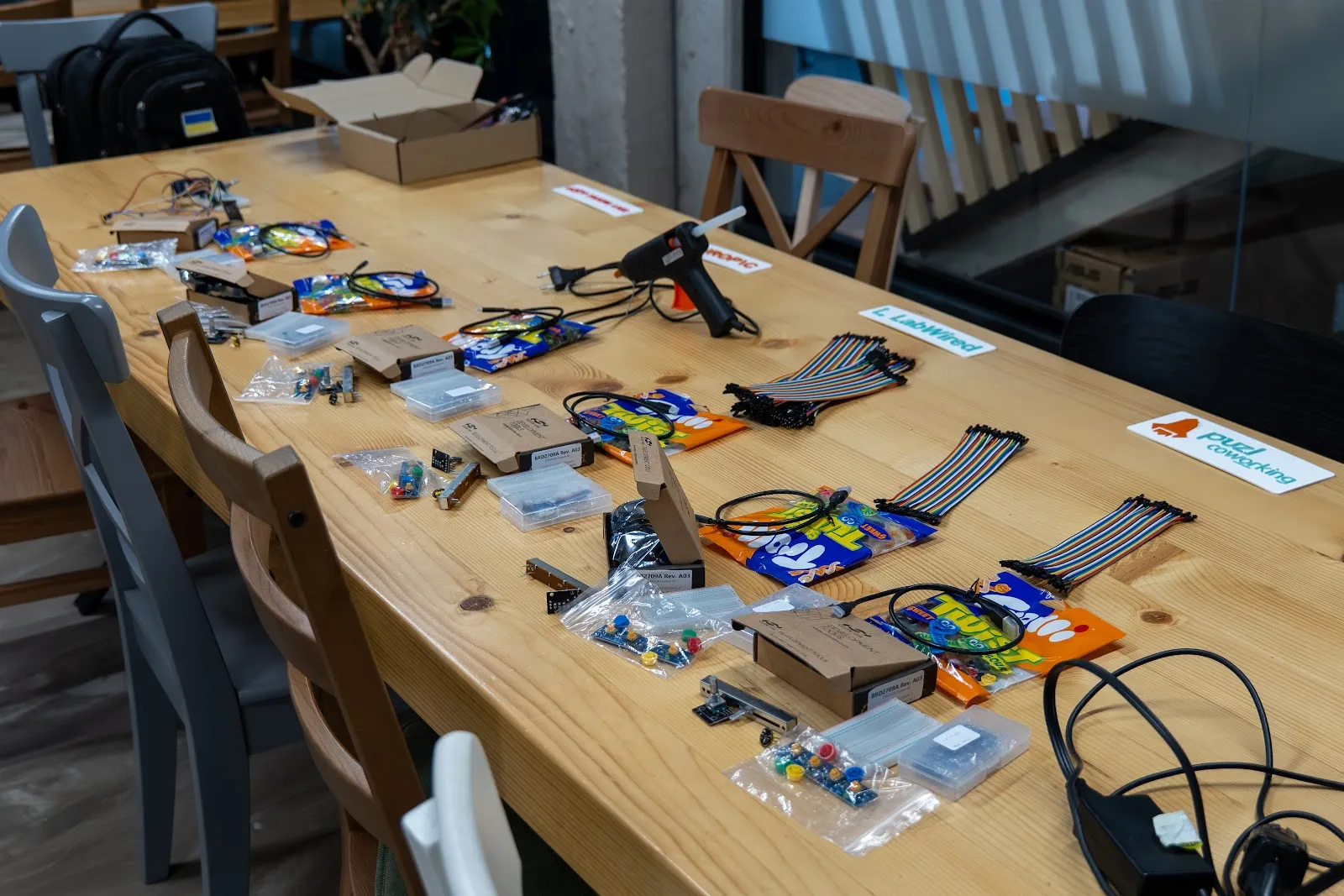 Hardware boards, components and cables laid out on the parts table